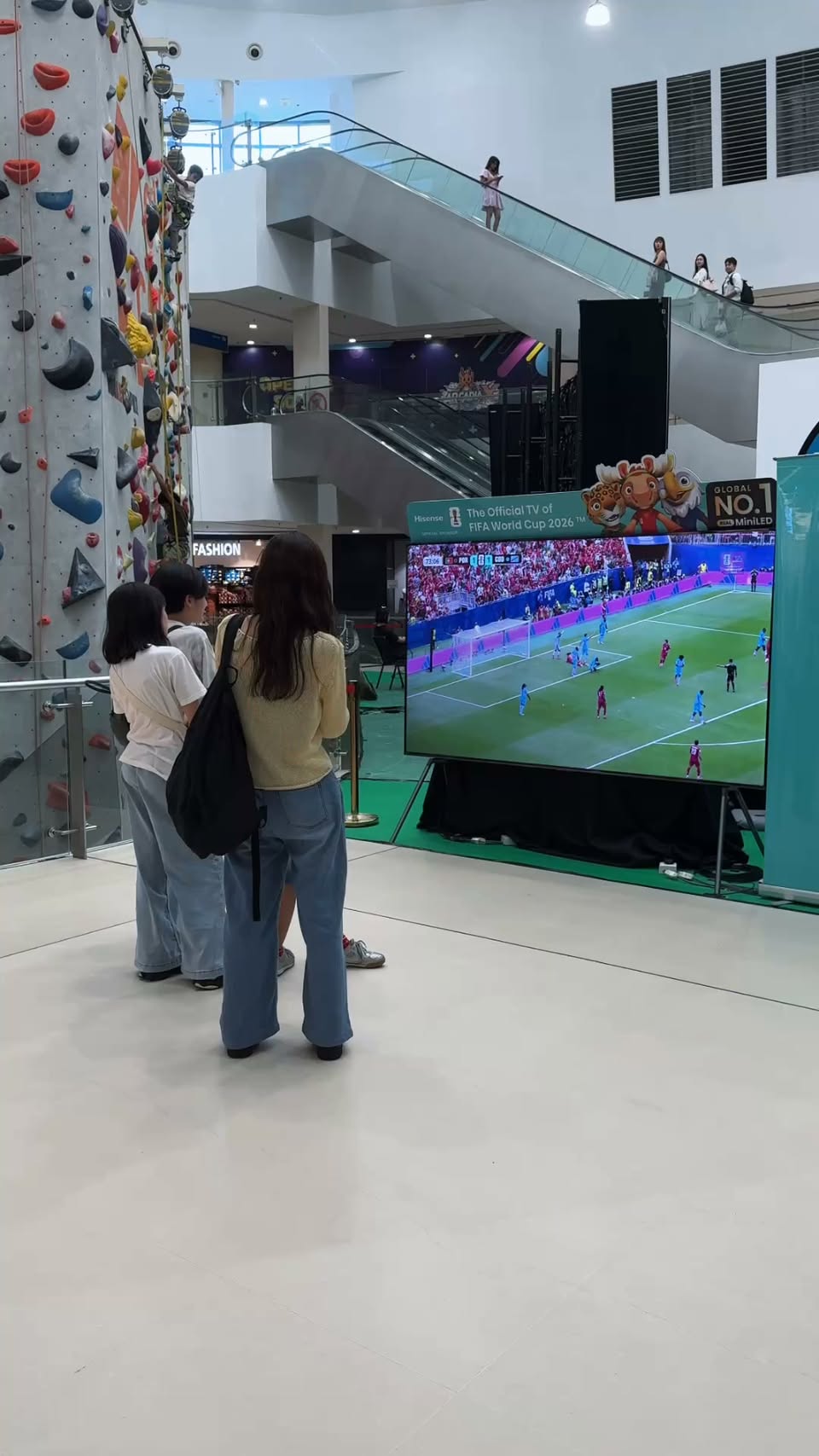 Shoppers walking through Kallang Wave Mall