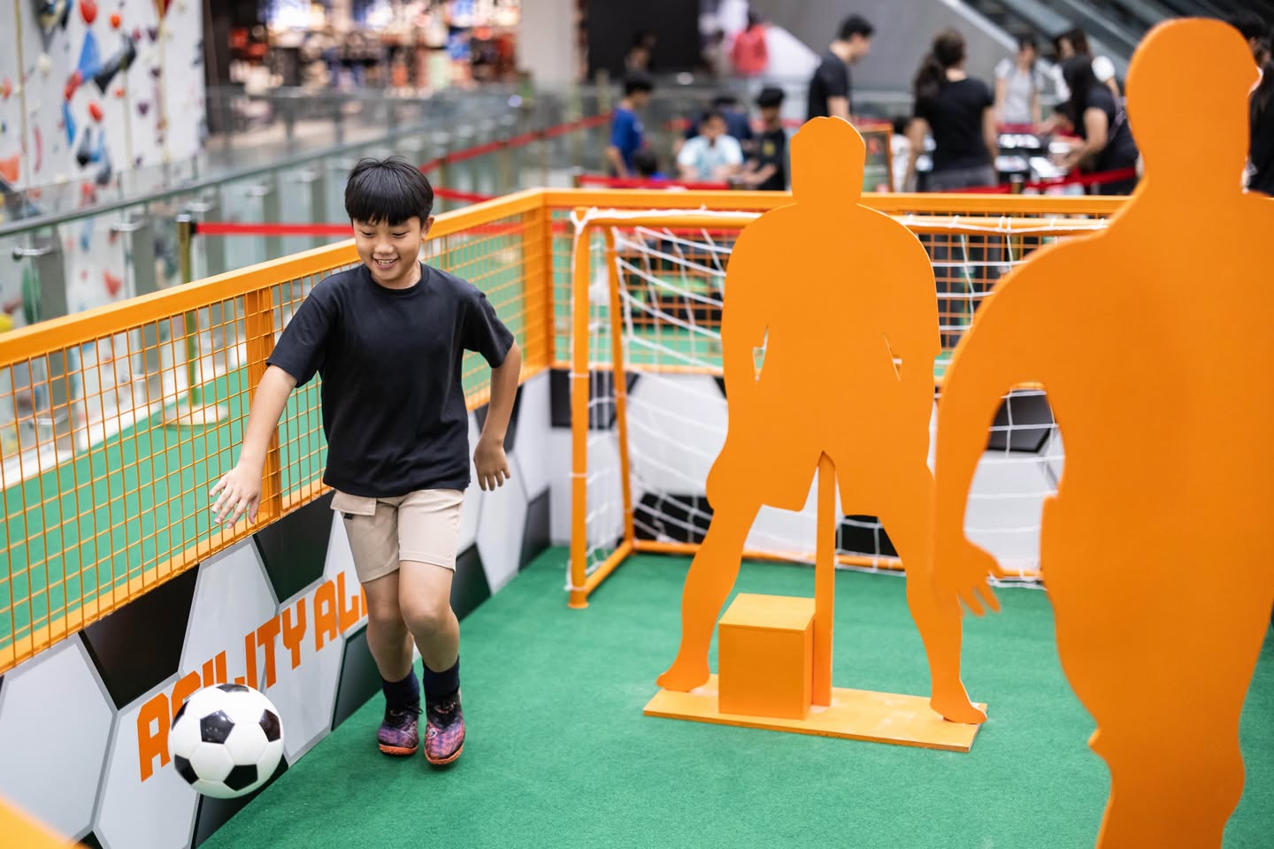 Own The Pitch football challenge at Kallang Wave Mall with families participating