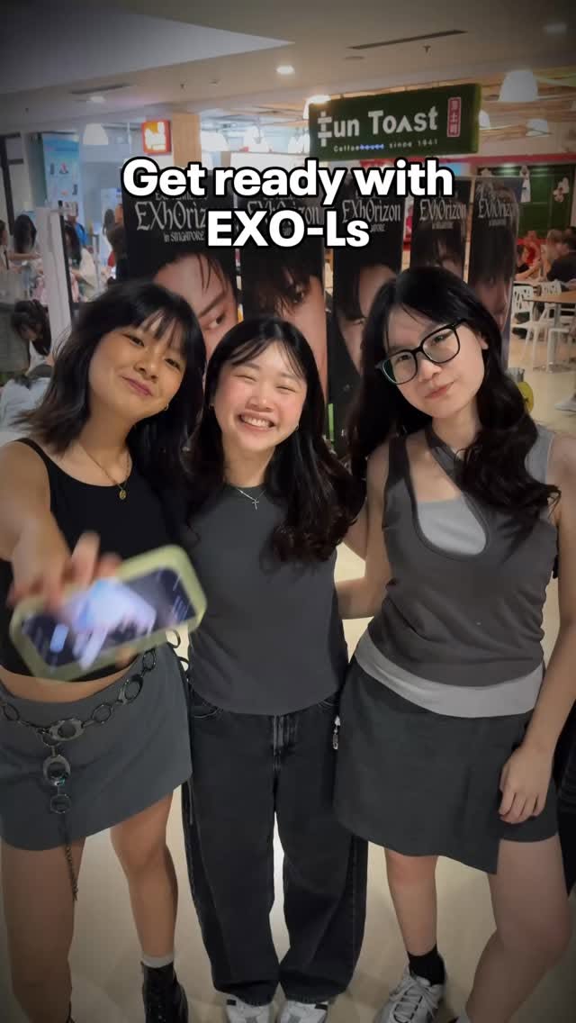 EXO fans holding light sticks at Kallang Wave Mall