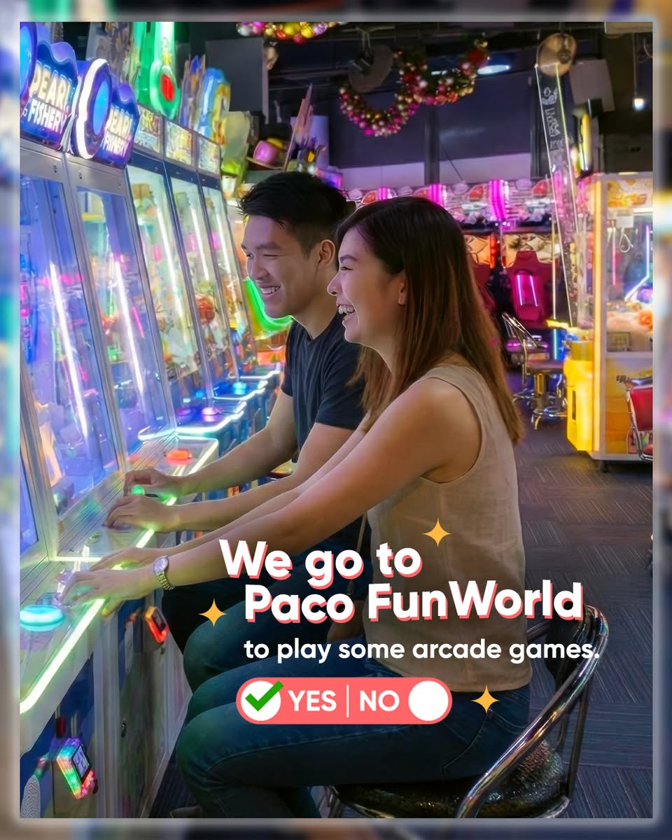 Couple laughing and playing arcade games
